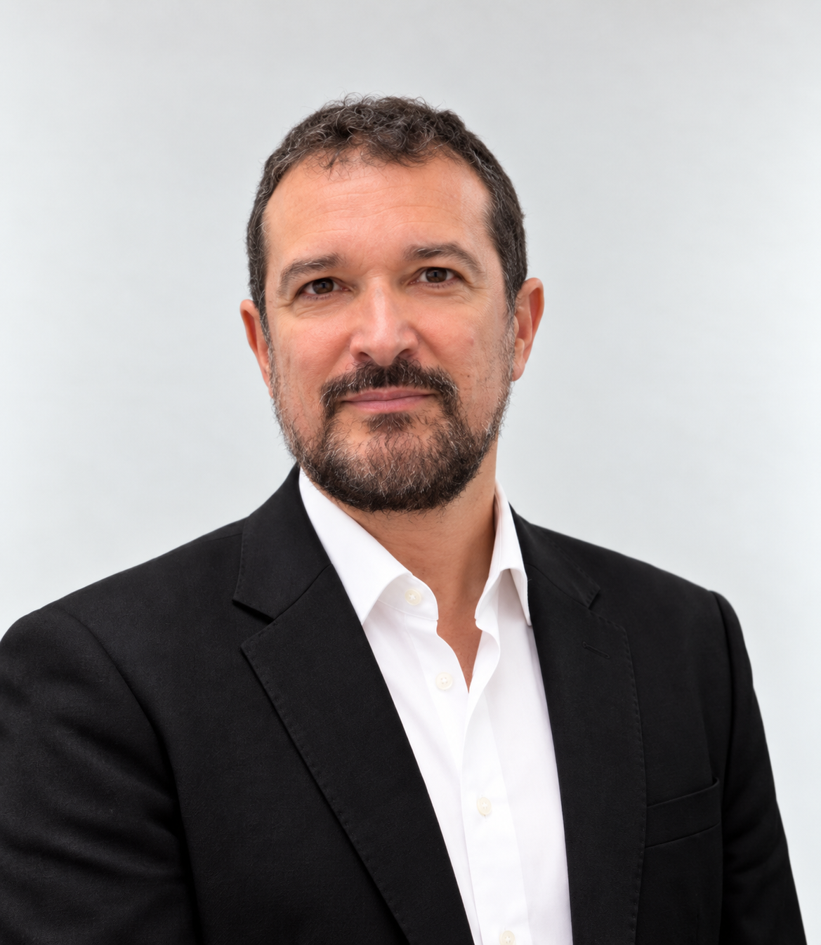 Jose Martin, wearing a black jacket and white shirt